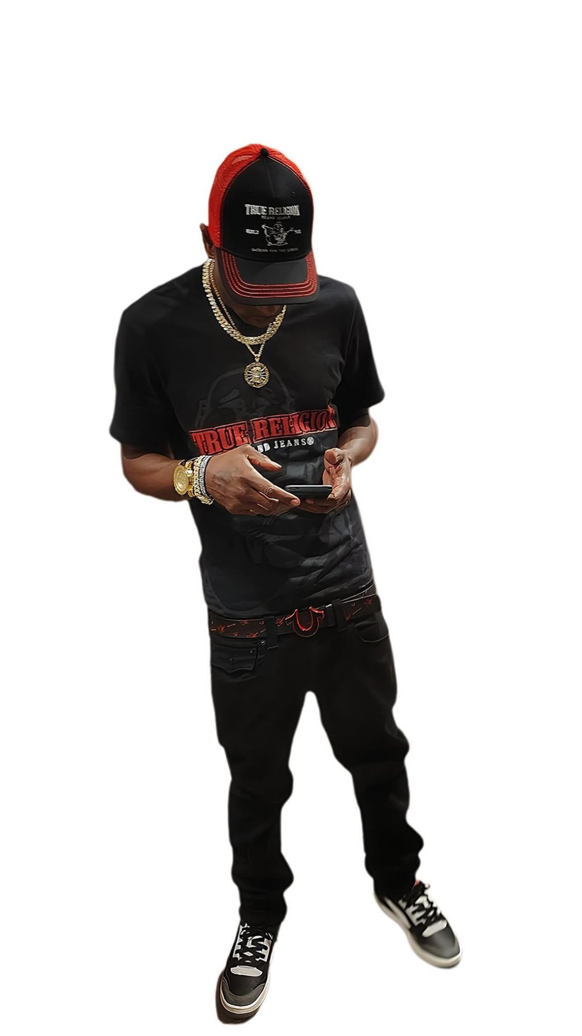 Full-length portrait of Twan G Young Gutta dressed in black and red