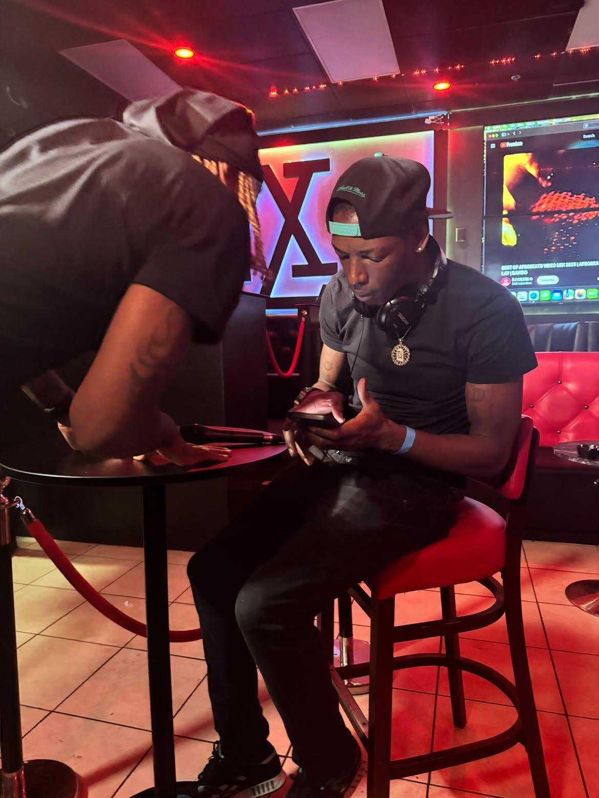 Wide view of Twan G Young Gutta seated in the venue