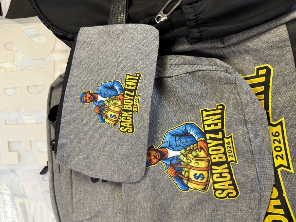 Grey Sack Boyz Entertainment 2026 merchandise bags printed with the black money-bag logo